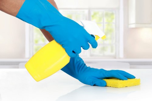 Professional Airbnb cleaner preparing a guest-ready rental bedroom
